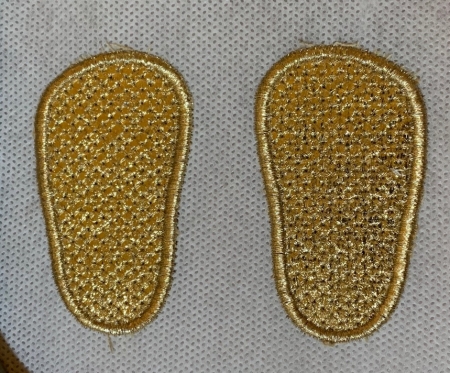 Shoe soles , embroidery is done.