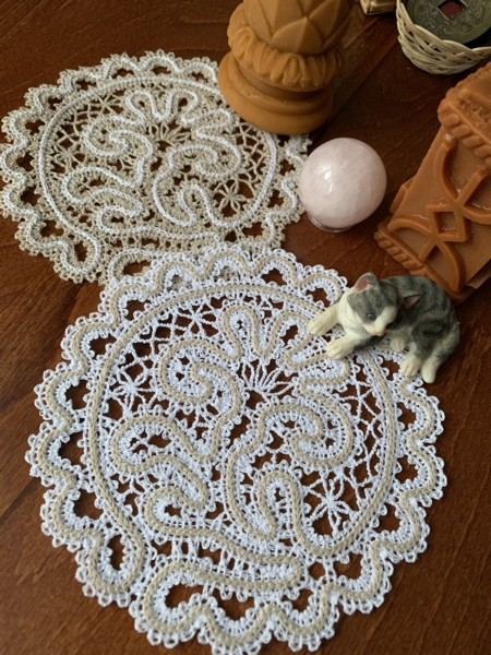 2 stitch-outs of the Battenberg Lace Flower Doily.