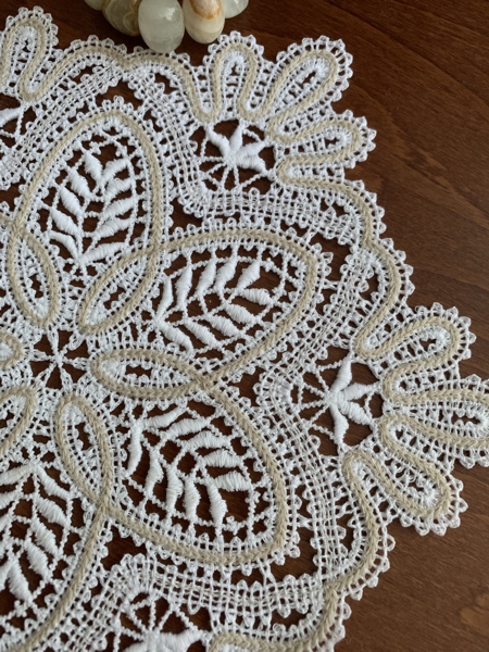 Stitch-out of the Battenberg lace doily design. Close-up.