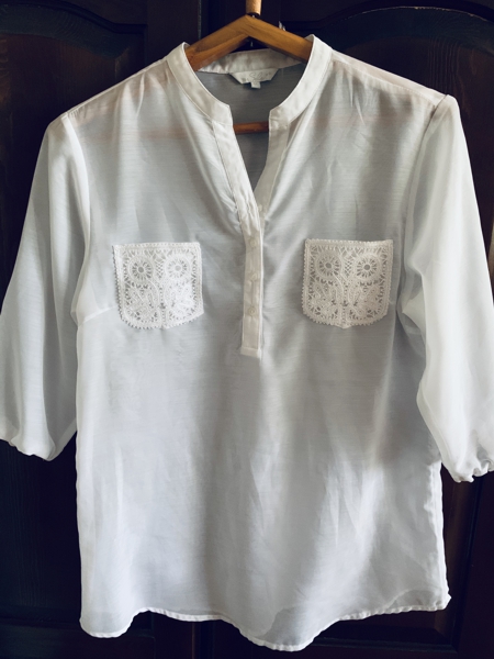 A shirt with lace pockets.