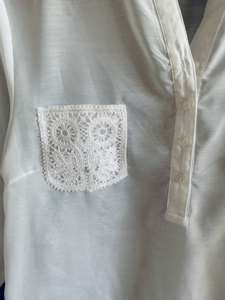 Close-up of the shirt with lace pocket