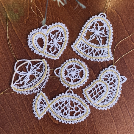 Stitch-outs of 6 ornaments of the set.