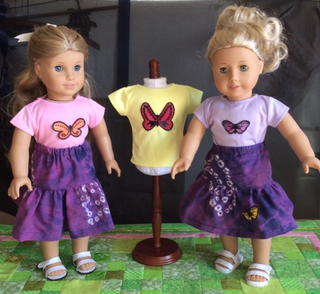 Dolls in t-shirts decorated with butterfly applique