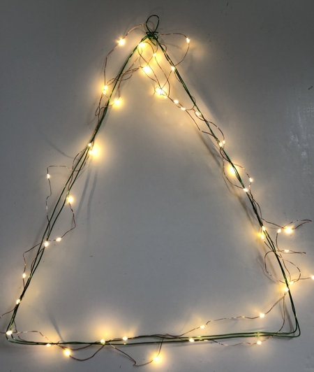 Wire frame wrapped in fairy lights garland.