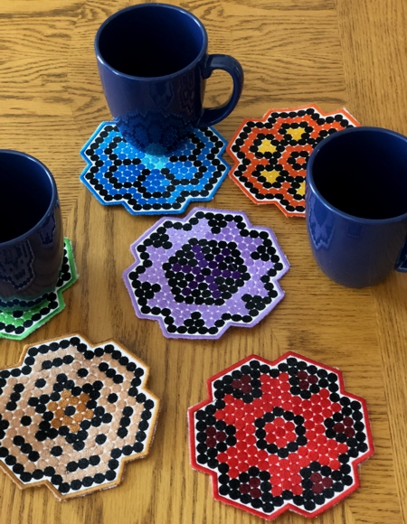 Finished coasters with mugs.