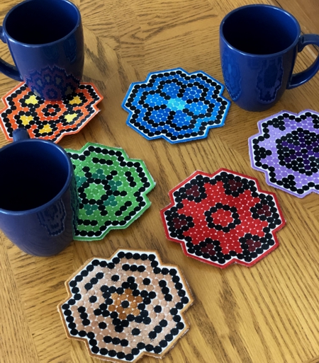 Finished coasters with mugs.