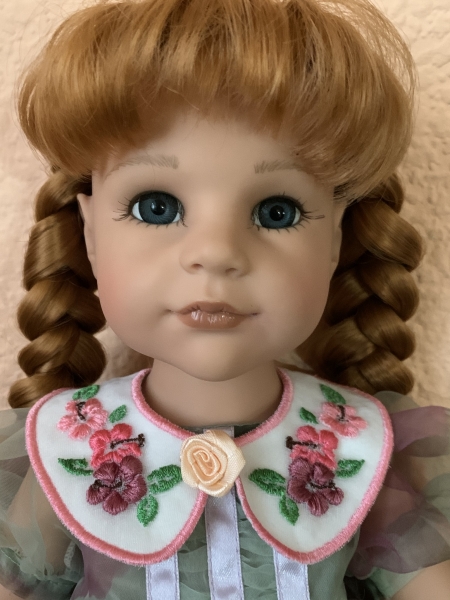 Doll in a finished collar.