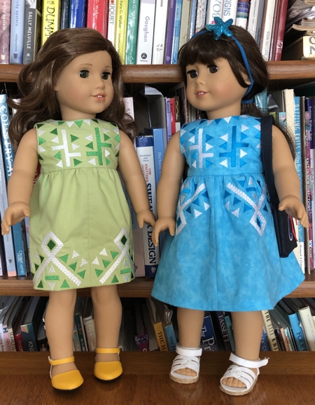 Dolls in finished dresses.
