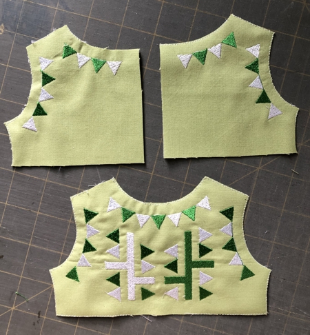 2 backs and 1 front stitch-outs of the dress.