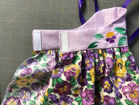 Sew Velcro tape to the back of the bodice.