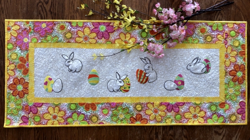 Finished quilted table runner with Easter bunny and eggs embroidery.