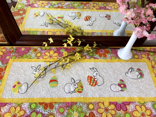 Finished quilted table runner with Easter bunny and eggs embroidery.