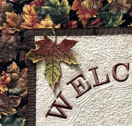 Close-up of freestanding maple leaf embroidery.