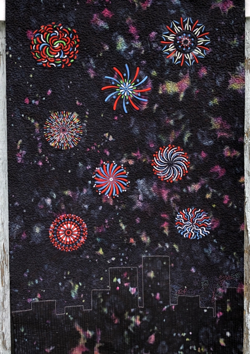 Finished wall quilt with the firework embroidery.