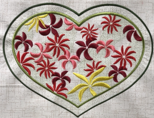 Stitch-out of the heart with flowers design.