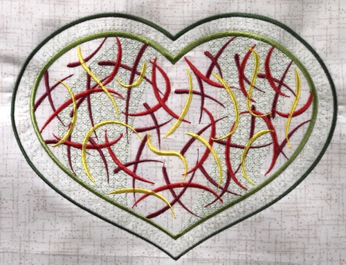 Stitch-out of the heart with abstract filling design.