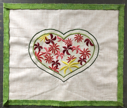 Green border attached to the front panel of the pillow.