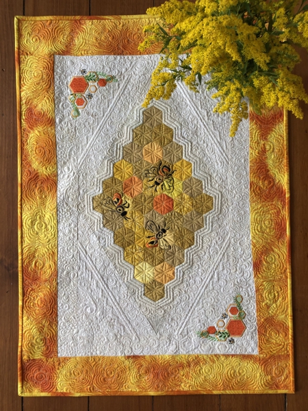 Finished tablerunner with bee embroidery.