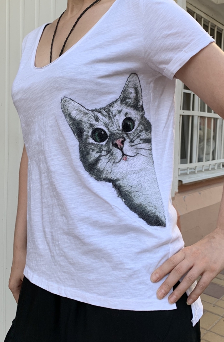 Cat embroidery on a T-shirt.