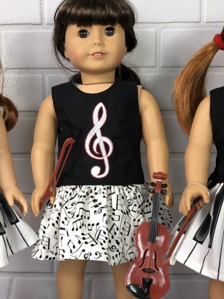 Finished dress with embroidery on bodice modeling by American Girl doll Samantha