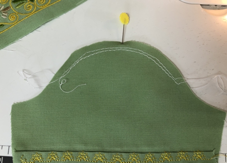 With a decorative stitch sew the folded edge in place.
