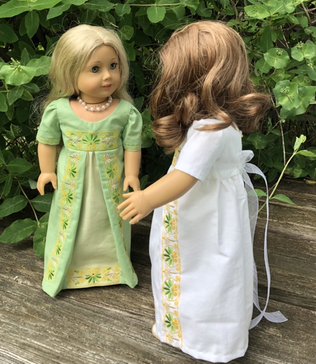 Finished dresses on dolls.