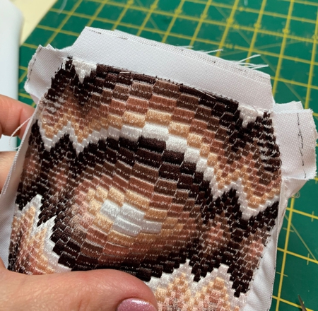 Cut out the fabric between the straight and sloped sections on the upper edge
