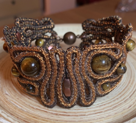 Finished bracelet decorated with beads.