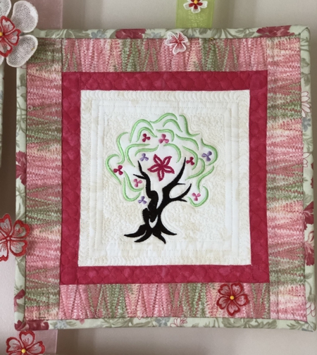 Spring-themed one-block quilt.
