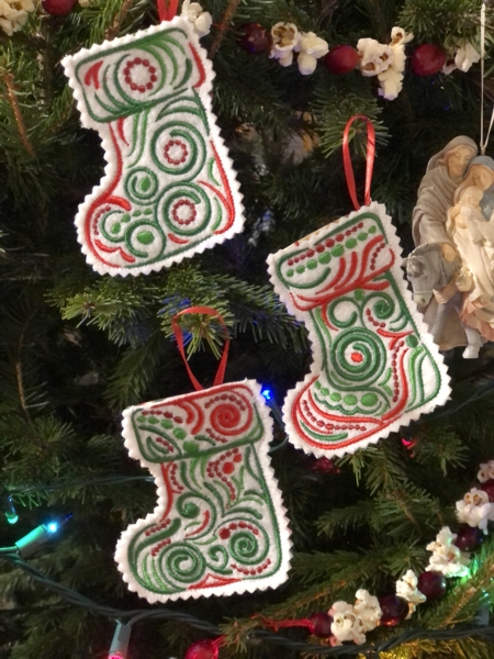 Finished stocking ornaments on a Christmas tree.