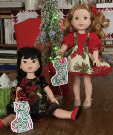 14-inch dolls with Christmas stockings.