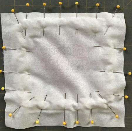 Cover the stitch-out with the backing, face inside.