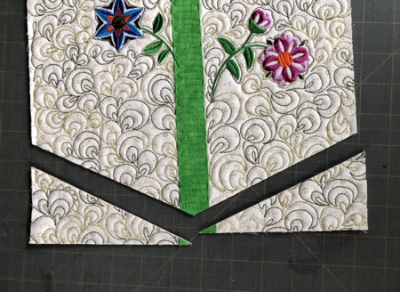 The wallhanging with both lower corners cut away.