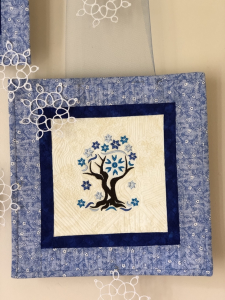 Winter-themed one-block quilt.