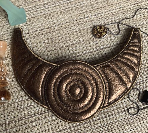 Stitch-out of the gorget on thin faux leather.