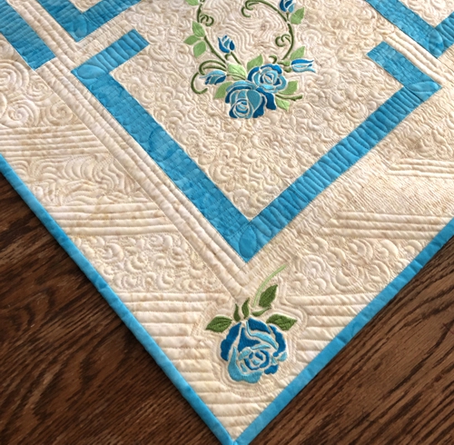 Close-up of the embroidery and quilting.