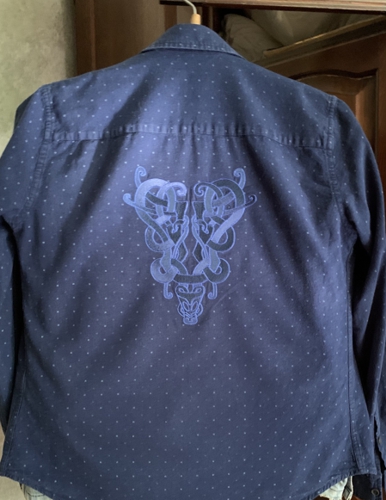 Celtic embroidery on the back of a man's shirt