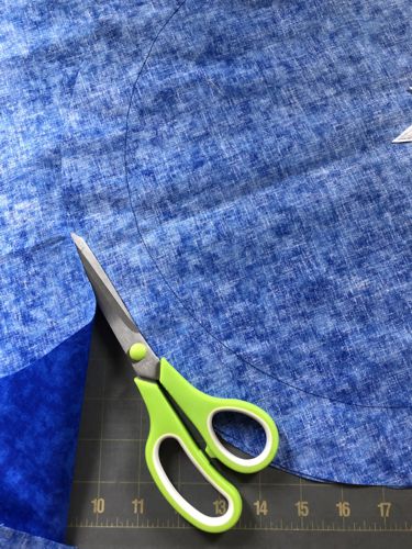 cut away the fabric along the edge of the "star" circle.