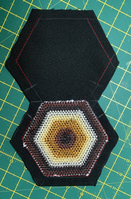 Stitch the sides together as shown by the red line -leaving one side open.