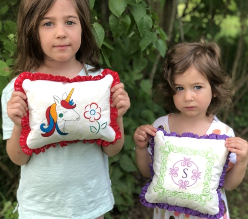 2 finished pillows with embroidery and ruffles