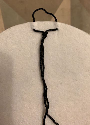 A loop on the back of the wallhanging