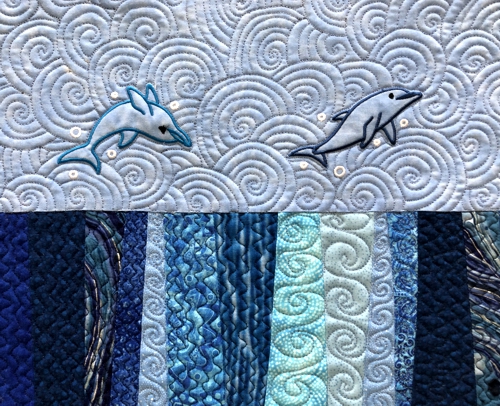 Close-up of the quilting and embroidery.