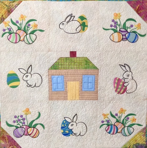 The central part of the quilt with embroidery.
