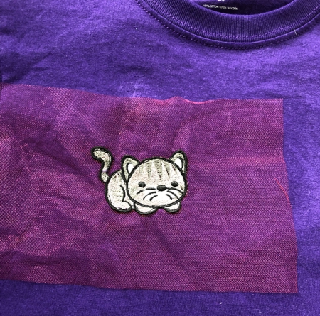 Stitch-out of a kitten sewn to the t-shirt