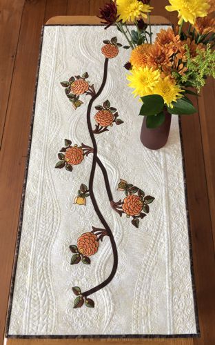 Finished quilted tablerunner with flower embroidery