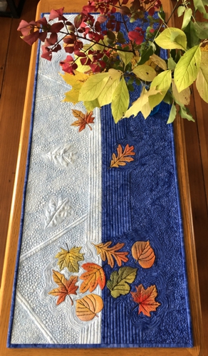 Finished quilted tablerunner with fall leaves embroidery
