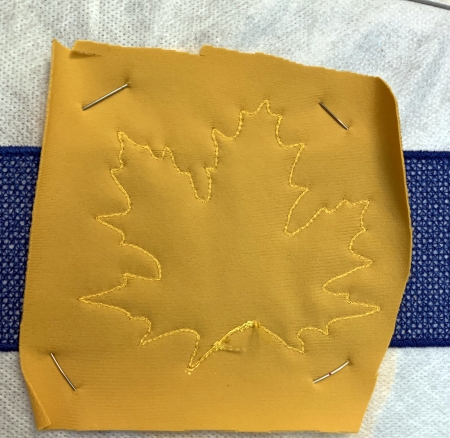 The outline of the leaf on the back of the embroidery.