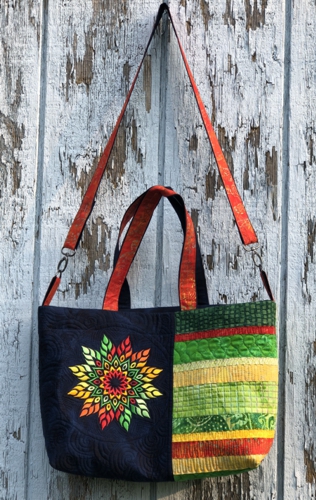 Finished tote bag with embroidery of a fall star on the front panel.