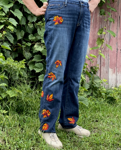 Jeans embellished with leaves embroidery