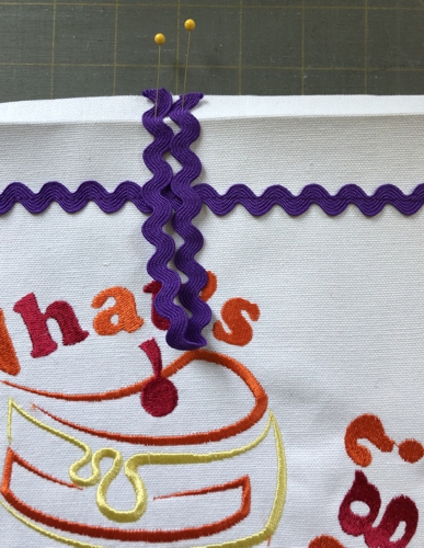 Pin the loop ends to the upper edge of the stitch-out.